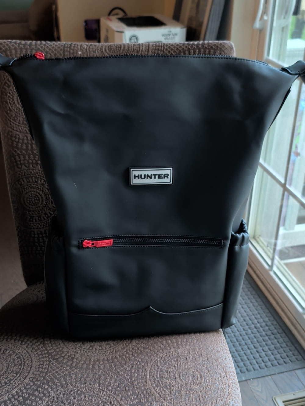 Hunter Black Backpack with Red Zipper Pull